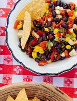 Overhead image of black bean and corn salsa with Tuttorosso Tomatoes and chips